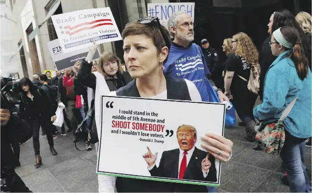  ?? MARK LENNIHAN / THE ASSOCIATED PRESS ?? Protesters against Trump’s rhetoric march Wednesday in front of Trump Tower, the New York residence of the Republican presidenti­al candidate.