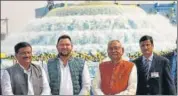  ?? SANTOSH KUMAR/HT PHOTO ?? CM Nitish Kumar, his deputy Tejashwi Prasad Yadav and water resources minister Sanjay Jha after the inaugurati­on of the project in Gaya on Monday.