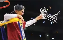  ?? ABBIE PARR — GETTY IMAGES ?? Stanford coach Tara VanDerveer celebrates after cutting down the net after defeating Texas in the Elite 8 Round in Spokane, Wash.