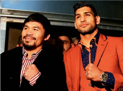  ?? Getty Images ?? Manny Pacquiao and Amir Khan confirm they would face each other in UAE on April 23. —