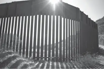  ??  ?? middle
East of Tijuana the fence becomes more of a ballard design, to allow for the Border Patrol agents to monitor movement south of the border fence.