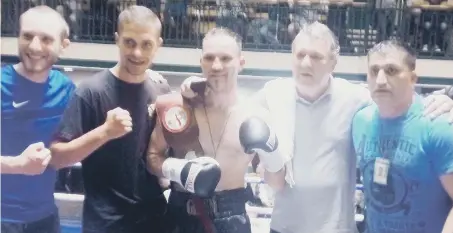  ??  ?? The Foot team celebrate Glenn’s success at the York Hall in Bethnal Green on Saturday.