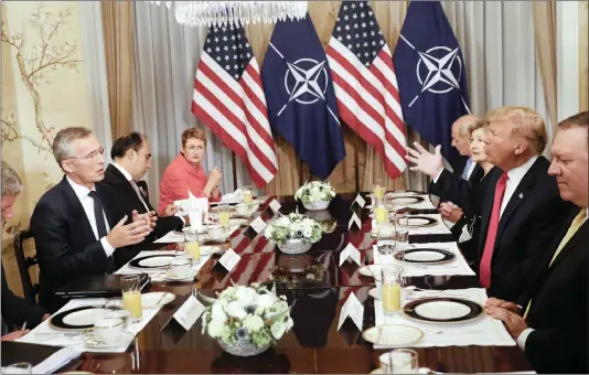  ?? PICTURE: PABLO MARTINEZ MONSIVAIS/AP ?? US President Donald Trump, second right, and NATO Secretary General Jens Stoltenber­g, left, gesture while speaking during their bilateral breakfast,yesterday in Brussels, Belgium.