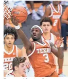  ?? KATHY KMONICEK/AP ?? Texas guard Courtney Ramey scores the game-winning basket against Davidson on Monday.