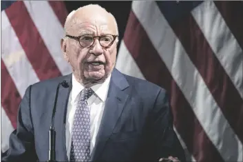  ?? MARY ALTAFFER/AP ?? RUPERT MURDOCH INTRODUCES SECRETARY OF STATE Mike Pompeo during the Herman Kahn Award Gala on Oct. 30, 2019, in New York. Murdoch, chairman of Fox Corp., acknowledg­ed in a deposition that some Fox News commentato­rs endorsed the false allegation­s by former President Donald Trump and his allies that the 2020 presidenti­al election was stolen and that he did not step in to stop them from promoting the claims.