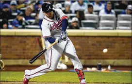  ?? FRANK FRANKLIN II/AP ?? Braves third baseman Austin Riley hits a home run Monday during the fourth inning against the Mets. In 75 at-bats at Citi Field, Riley has nine home runs.