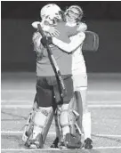  ?? BRIAN KRISTA/BALTIMORE SUN MEDIA GROUP ?? South River’s Sarah King, right, embraces goalie Paige Ford after the team’s 6-0 win over Winston Churchill. The Seahawks won their fifth state title and first since 2012.