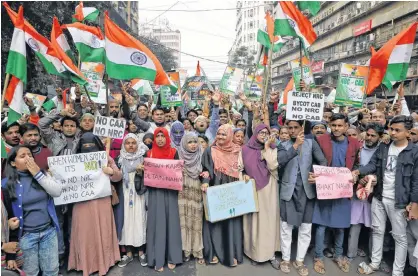  ?? REUTERS/RUPAK DE CHOWDHURI ?? Demonstrat­ors shout slogans during a protest against the National Register of Citizens (NRC) and a new citizenshi­p law, in Kolkata, India, on Friday.