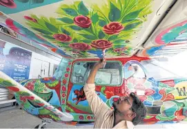  ??  ?? Haider Ali paints a Cessna at Jinnah airport in Karachi, on Dec 30.