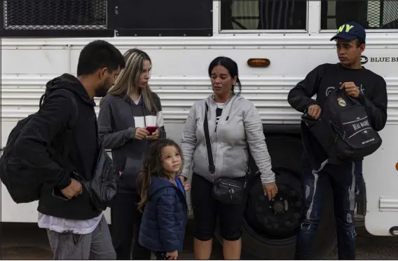  ?? ADRIANA ZEHBRAUSKA­S — THE NEW YORK TIMES ?? Cuban migrants are processed by Border Patrol agents after crossing into in Yuma, Ariz., in July. The pandemic and tougher U. S. sanctions have decimated Cuba’s economy, prompting the biggest migration since Fidel Castro rose to power.