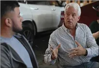  ?? JOSE CARLOS FAJARDO BAY AREA NEWS GROUP ?? Republican governor candidate John Cox speaks to employee Juan Rojas, of Modesto, while visiting Platinum Auto Collision &amp; Paint during a campaign stop in Berkeley on Monday.