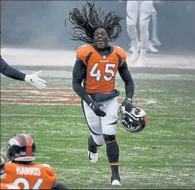  ?? HELEN H. RICHARDSON / The Denver Post ?? Broncos linebacker Alexander Johnson sprints on to the field during pregame introducti­ons Sunday at Empower Field at Mile High in Denver,