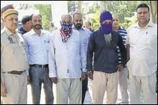  ?? HT PHOTO ?? The accused in police custody in Hoshiarpur on Monday.