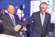  ?? CLIFF OWEN/ASSOCIATED PRESS ?? National Governors Associatio­n Chairman Terry McAuliffe of Virginia, right, shakes hands with Alabama governor Robert Bentley in Washington Saturday.