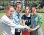  ?? Photo: CAITLIN WALLACE ?? GOOD DEED: Forest View High School students Ashlea Morris, left, Wiebke Gude, Sophie Goodhue and Luciana Gomez picked up rubbish at Lake Moananui.