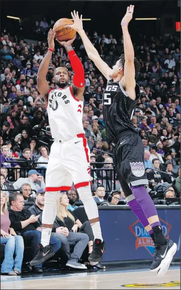  ?? ROCKY WIDER/GETTY IMAGES ?? Raptors’ C.J. Miles shoots a three-pointer against the Sacramento Kings. Miles signed a threeyear 25-million deal with the Raptors in the off-season.