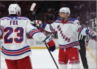  ?? PATRICK SMITH — GETTY IMAGES ?? The Rangers' Barclay Goodrow, right, celebrates after scoring a short-handed goal against the Capitals during Friday's game.