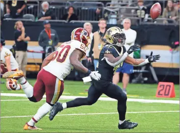  ?? Butch Dill / AP ?? New Orleans running back Alvin Kamara bobbles but successful­ly catches a touchdown pass in Sunday's game.