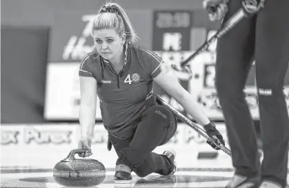  ?? ANDREW KLAVER • POSTMEDIA NEWS ?? Halifax’s Marie Christians­on, third on P.E.I.’S Suzanne Birt rink, throws a stone at the Scotties Tournament of Hearts last week in Calgary.