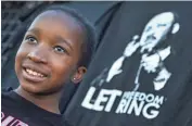  ?? PHOTOS BY TOM TINGLE/THE REPUBLIC ?? Olivia Hunter, 8, participat­es in a King Day celebratio­n Monday at Margaret T. Hance Park in Phoenix.