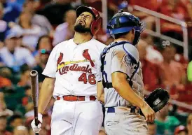  ?? [AP PHOTO] ?? Cardinals catcher Francisco Pena, left, reacts after being called out on strikes against the Dodgers on Sept. 13 in St. Louis.