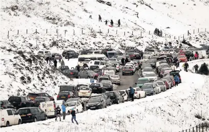  ??  ?? Vehicles parked on verges on the A470, near Pen y Fan during last year’s snow fall, caused problems for traffic and emergency services