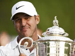  ?? PHOTO: USA TODAY SPORTS ?? Trophy time . . . American Brooks Koepka celebrates with the trophy after his victory in the PGA Championsh­ip at Rochester, New York, yesterday.