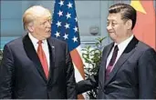  ?? SAUL LOEB/AP ?? President Donald Trump speaks with Chinese President Xi Jinping at the Group of 20 summit in Hamburg. U.S. and Chinese economic officials are meeting Wednesday.