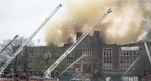  ?? TIJANA MARTIN THE CANADIAN PRESS ?? York Memorial Collegiate caught fire and burned for two days. No one was hurt, but a place of learning lost many of its precious resources, including its many books.