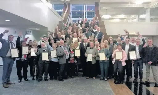  ??  ?? ●●The Mayor & Mayoress of Rochdale are joined by councillor­s, representa­tives of In bloom community groups and council staff in celebratin­g the borough’s 37 In Bloom awards