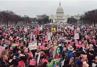  ?? AFP ?? Demonstrat­ors protest on the National Mall in Washington, DC, for the Women’s March yesterday. Protesters rallied across the US to send a defiant message to Trump.