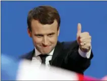  ?? CHRISTOPHE ENA — THE ASSOCIATED PRESS ?? Then-French centrist presidenti­al candidate Emmanuel Macron thumbs up as he addresses his supporters at his election day headquarte­rs in Paris.