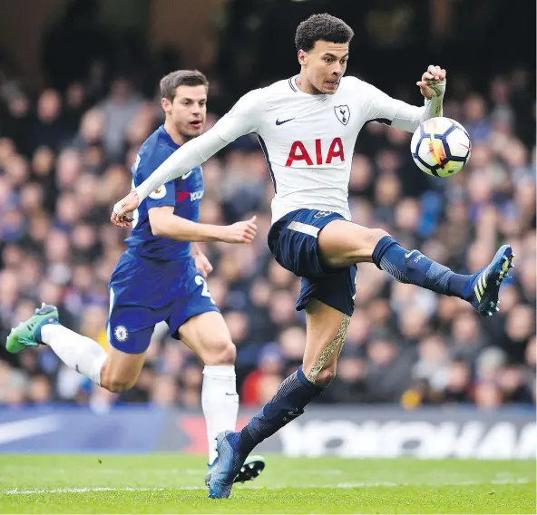  ?? — GETTY IMAGES ?? Tottenham midfielder Dele Alli is in full stride as he makes a play on the ball during English Premier League action Sunday at Stamford Bridge in London. Alli scored twice as Tottenham ended a 28-year winless drought in Chelsea by virtue of its 3-1...