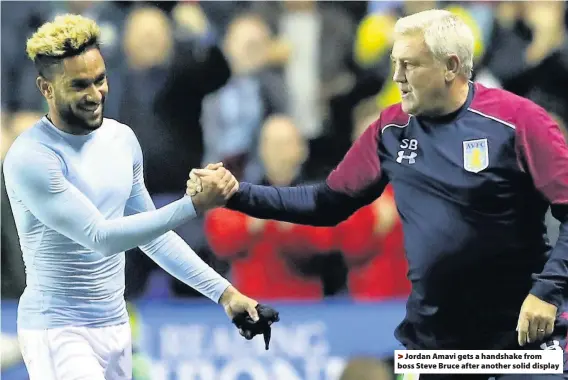  ??  ?? >
Jordan Amavi gets a handshake from boss Steve Bruce after another solid display