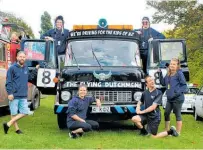  ??  ?? Mark Wilson’s (front, second from right) team with their fire truck — ‘The Flying Dutchmen’.