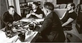  ??  ?? Tom Sizemore, from left, Derek Potts, Shawn Welling and Victor Gelsomino go over the “Narco Sub” script.