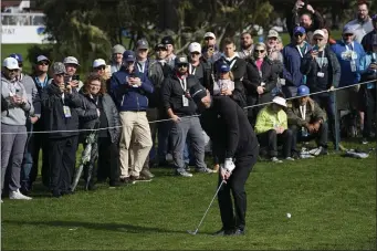  ?? GODOFREDO A. VÁSQUEZ — THE ASSOCIATED PRESS ?? Aaron Rodgers follows his shot onto the 16th green of the Pebble Beach Golf Links during the third round of the AT&T Pebble Beach Pro-Am golf tournament in Pebble Beach, Calif., Sunday, Feb. 5, 2023.