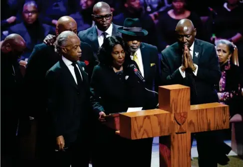  ?? (Reuters) ?? The Rev Al Sharp ton, left, and RowVaughn Wells, Nichols’ sm other, at the service in Memphis last night