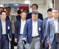  ?? YONHAP/THE KOREA HERALD ?? Executives from South Korean chipmakers attend emergency meeting held by Trade Ministry on Monday in Seoul.