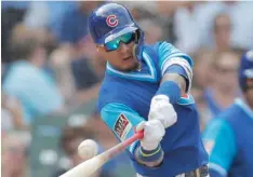  ?? JIM YOUNG/AP ?? Javy Baez belts a solo home run in the fifth inning.