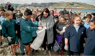  ?? CAMERON BURNELL/STUFF ?? Prime Minister Jacinda Ardern announced a phasing out of plastic bags during a beach cleanup at Lyall Bay in Wellington.