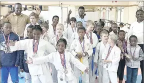  ?? (Courtesy pics) ?? A section of the youngsters excitedly displaying their medals after the Eswatini Japan Karate Shoto Tournament last Saturday at Mbabane Club.