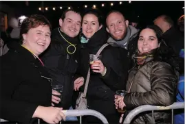  ??  ?? Caroline and Alan Toomey, Deirdre O’Sullivan, Cody Evenhus and Aoife Maguire among the throng on the small bridge at the dawning of the new year.