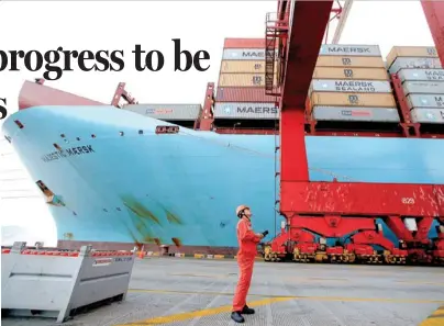  ?? ALY SONG / REUTERS ?? A cargo ship docks at Yangshan Deep Water Port in Shanghai. “Maintainin­g stability while seeking progress” will be an important principle for China’s economic work next year.