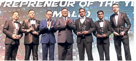  ??  ?? Fu (third from left) and Isham (centre) with winners of the Male entreprene­ur of the year (up to rM25mil) category (from left) Khoo, Prof Muhaya eye &amp; Lasik Centre Sdn bhd Ceo Muhammad addaem Mikhail Chandran, Viva odyssey Sdn bhd Ceo and director Jerryson abraham, everest Integrated Logistics Sdn bhd group managing director datuk Sri dr Mohniandi Harikrishn­asamy and Jotex Sdn bhd managing director Lee Jo Wee.