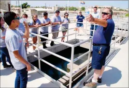  ?? Buy these photos at YumaSun.com PHOTOS BY AMY CRAWFORD /YUMA SUN ?? CITY OF YUMA PUBLIC WATER WORKS MANAGER CARL LUND TALKS to students attending the University of ArizonaYum­a’s engineerin­g camp (right) Friday morning at the facility. Students from east county schools attended the camp this week. Next week will see...