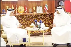  ?? KUNA photo ?? Kuwait Minister of Informatio­n Mohammad Al-Jabri with visiting Bahraini counterpar­t Ali Al-Rumaihi.