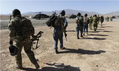  ?? Photograph: Australian Department of Defence/AAP ?? Australian and Afghan officers in 2010. ‘The war may be ending for us but it’s certainly not ending for the Afghan people … To be honest there are no victory parades.’