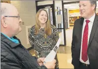  ?? SUBMITTED PHOTO/STEVE WADDEN FOR CNS ?? Local resident Joe Muise, left, speaks to Jolene Larade, executive director for Conseil des arts de Cheticamp, and Acadian Affairs Minister Michel Samson following a funding announceme­nt in Cheticamp on Saturday.