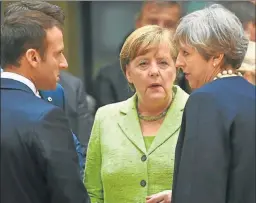  ??  ?? SERIOS. Macron, Merkel y May, apoyaron el pacto. El vicecancil­ler ruso y la vocera china, también.